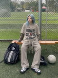 DAXUEN light taupe distressed graphic long sleeve t-shirt — model photo