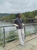 DAXUEN Distressed tie-dye loose-fit pants — model photo