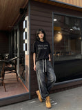 DAXUEN Distressed typewriter print short-sleeved T-shirt — model photo