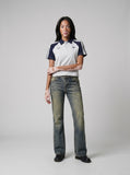 DAXUEN faded vintage blue distressed micro-flare jeans — model photo