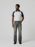 DAXUEN faded vintage blue distressed micro-flare jeans — model photo
