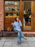 DAXUEN medium wash blue distressed wide-leg jeans — model photo