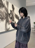 DAXUEN washed black distressed vintage panel hooded sweatshirt — model photo