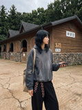 DAXUEN washed black distressed vintage panel hooded sweatshirt — model photo