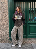 DAXUEN brown and black plaid shirt with distressed graphic — model photo