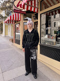 DAXUEN black distressed white graphic wide-leg sweatpants — model photo