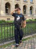 DAXUEN washed black distressed seated-figure graphic t-shirt — model photo