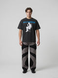DAXUEN washed black distressed seated-figure graphic t-shirt — model photo