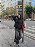 DAXUEN black distressed wide-leg denim jeans — model photo