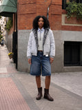 DAXUEN Distressed wide-leg knee-length denim shorts — model photo