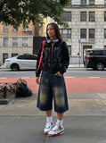 DAXUEN Distressed wide-leg denim shorts — model photo