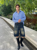 DAXUEN Distressed wide-leg denim shorts — model photo