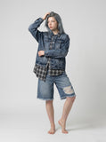 DAXUEN Distressed wide-leg denim shorts with rips — model photo