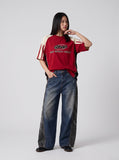 DAXUEN blue distressed wide-leg denim jeans with abstract panels — model photo