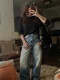 DAXUEN Distressed high-waisted wide-leg jeans in medium blue denim — model photo