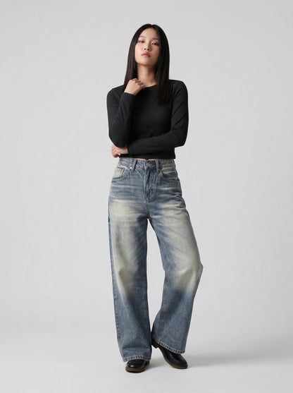 DAXUEN Distressed high-waisted wide-leg jeans in medium blue denim — model photo