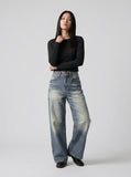 DAXUEN Distressed high-waisted wide-leg jeans in medium blue denim — model photo