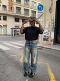 DAXUEN Distressed high-waisted wide-leg jeans in medium blue denim — model photo