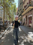 DAXUEN Distressed wide-leg jeans in dark blue wash — model photo