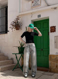 DAXUEN Distressed wide-leg jeans in washed grey denim — model photo