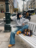 DAXUEN medium blue distressed wide-leg denim jeans — model photo