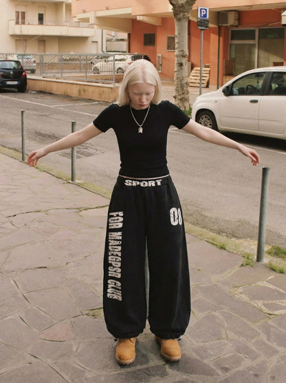 DAXUEN Distressed wide-leg sweatpants in black and grey — model photo