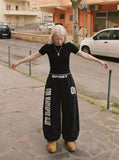 DAXUEN Distressed wide-leg sweatpants in black and grey — model photo