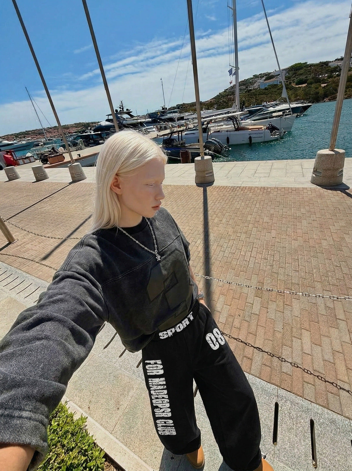 DAXUEN Distressed wide-leg sweatpants in black and grey — model photo