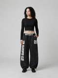 DAXUEN Distressed wide-leg sweatpants in black and grey — model photo