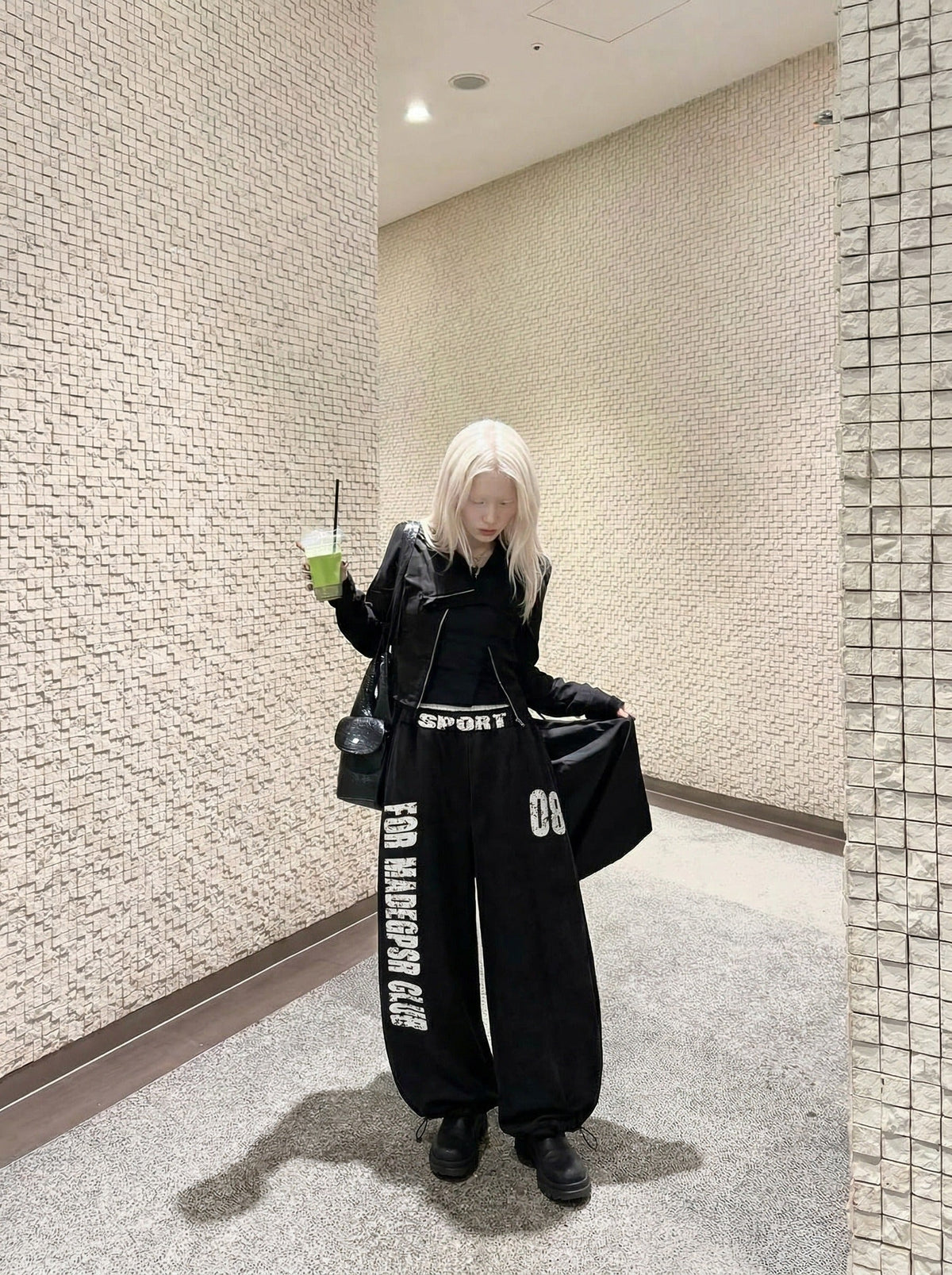 DAXUEN Distressed wide-leg sweatpants in black and grey — model photo