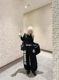 DAXUEN Distressed wide-leg sweatpants in black and grey — model photo