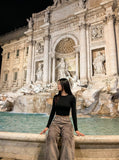 DAXUEN Distressed wide-leg trousers in taupe with paint splatters — model photo