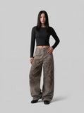 DAXUEN Distressed wide-leg trousers in taupe with paint splatters — model photo