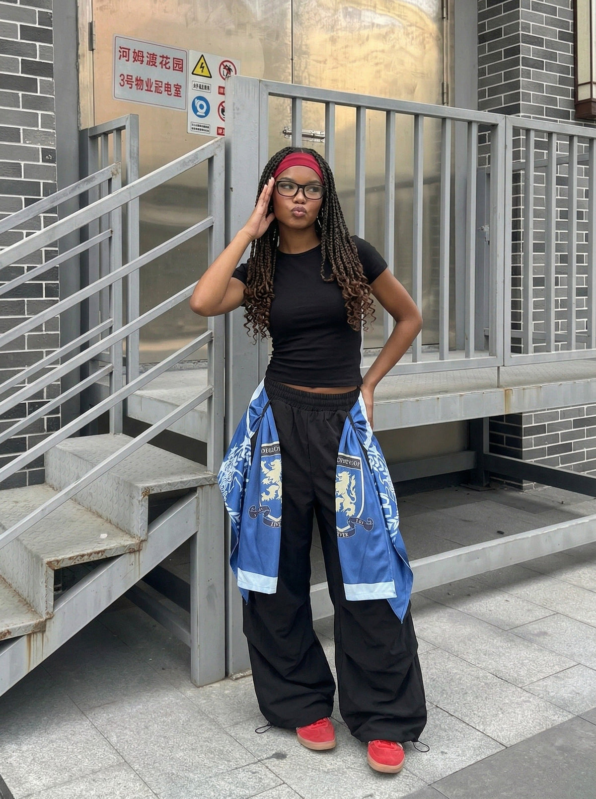 DAXUEN Draped graphic cargo pants with unique prints — model photo