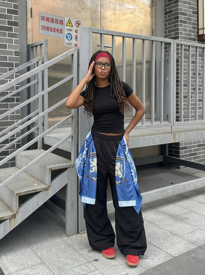 DAXUEN Draped graphic cargo pants with unique prints — model photo
