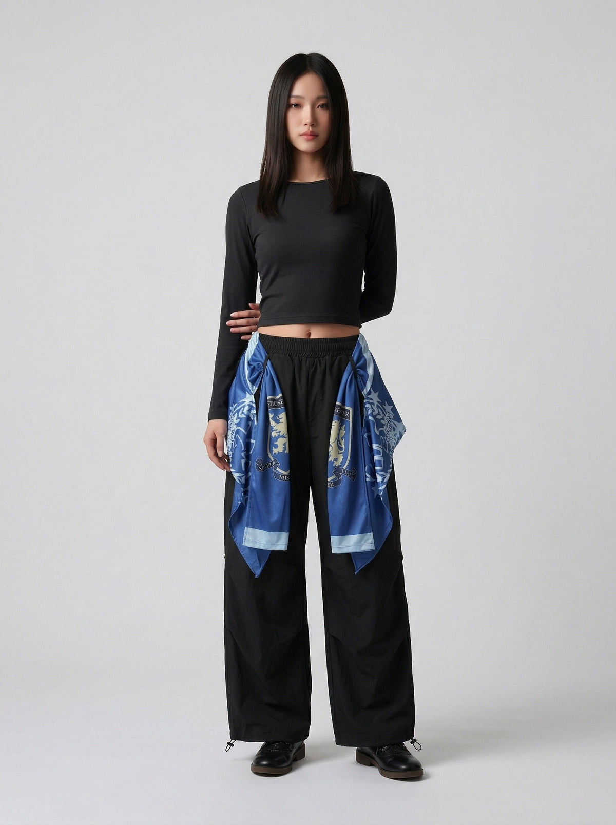 DAXUEN Draped graphic cargo pants with unique prints — model photo