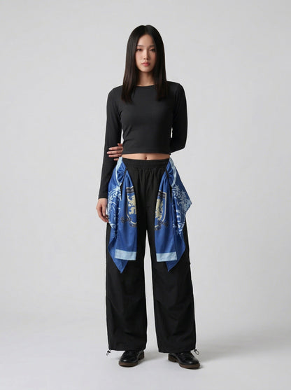 DAXUEN Draped graphic cargo pants with unique prints — model photo