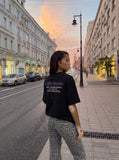 DAXUEN black oversized dual-graphic drop-shoulder t-shirt — model photo
