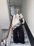 DAXUEN black long sleeve saxophone sketch t-shirt — model photo