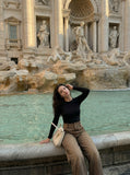 DAXUEN High-waisted wide-leg pants in earthy brown color — model photo