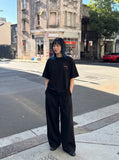 DAXUEN Oversized short-sleeve embroidered T-shirt in black and white — model photo
