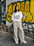 DAXUEN light ecru wide-leg striped casual pants — model photo