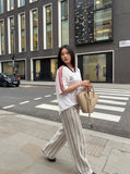 DAXUEN light ecru wide-leg striped casual pants — model photo