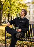 DAXUEN Men's relaxed-fit black bomber jacket — model photo