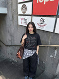 DAXUEN Edgy handwritten print T-shirt with raw edges — model photo