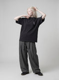 DAXUEN Oversized short-sleeve graphic t-shirt with raw edges — model photo
