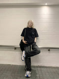 DAXUEN Oversized short-sleeve graphic t-shirt with raw edges — model photo