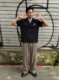 DAXUEN Short-sleeve polo shirt with striped details and embroidery — model photo