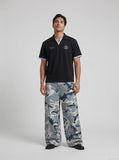 DAXUEN Short-sleeve polo shirt with striped details and embroidery — model photo