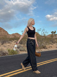 DAXUEN Wide-leg denim jeans with metal details — model photo